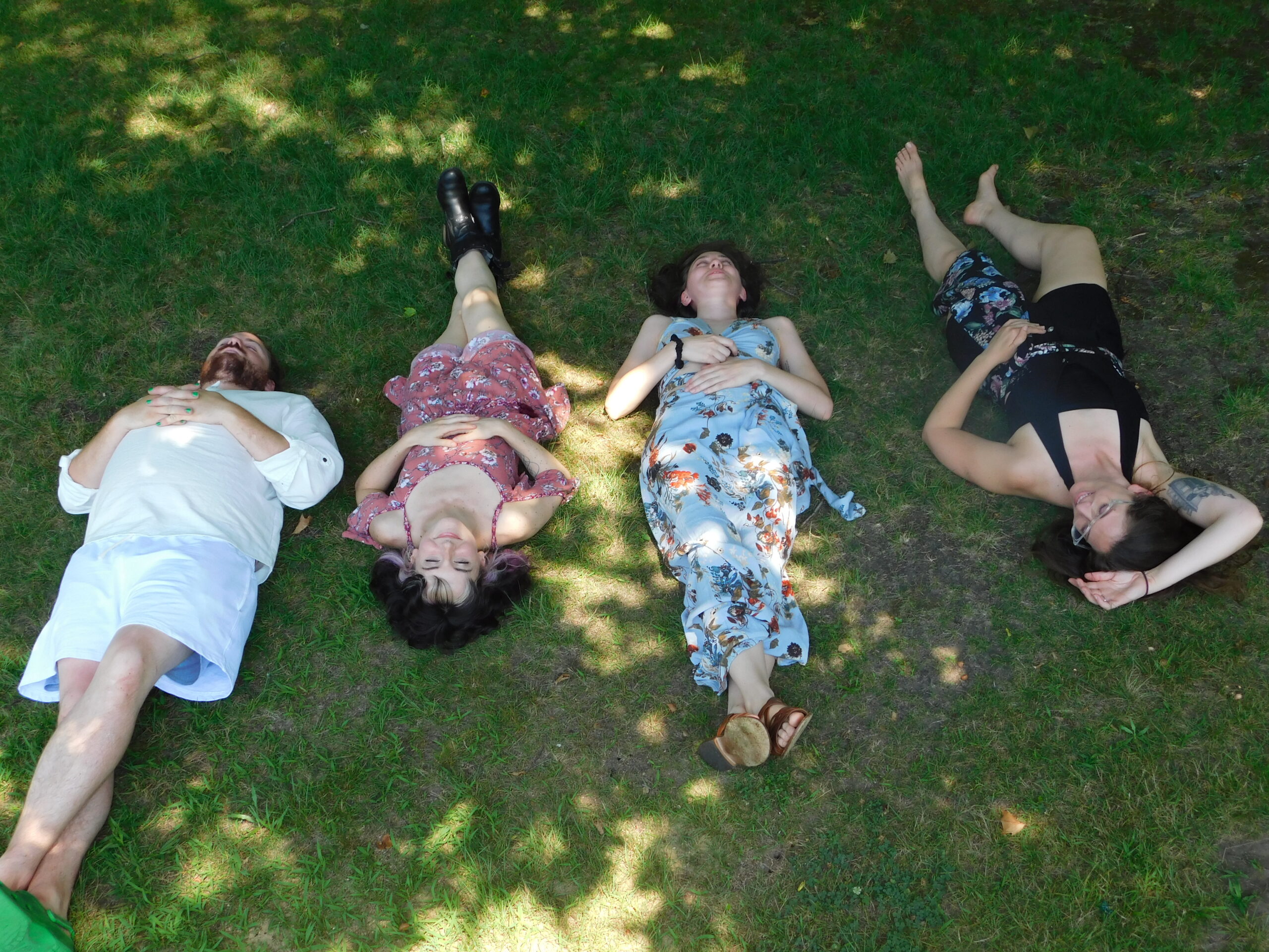 Beth's Band "How's About Charlie" laying in the grass